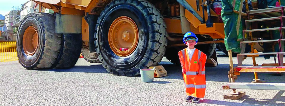 Reggie in PPE in front of Heavy Vehicle