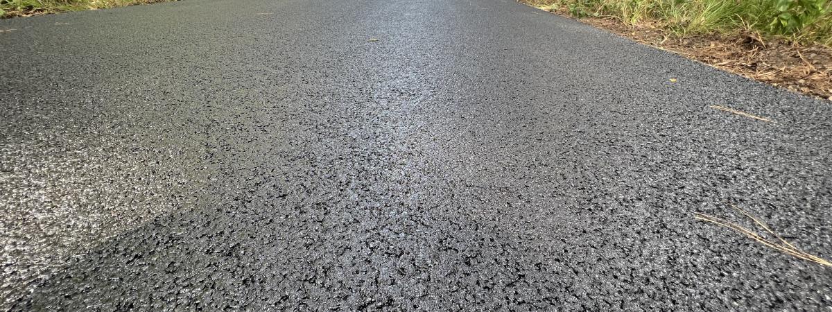 Road paved with asphalt mixed with crumbed rubber