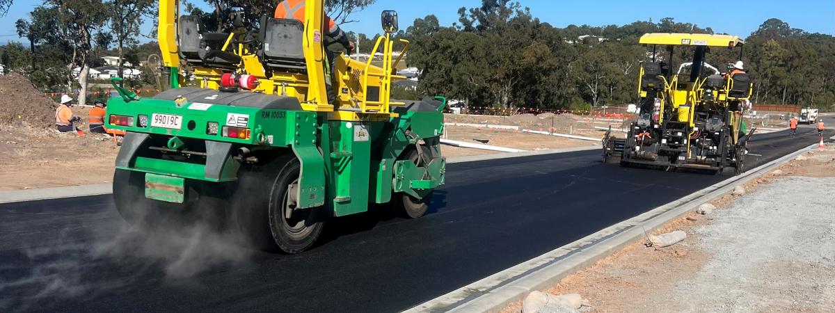 Asphalt paver laying road in Brisbane