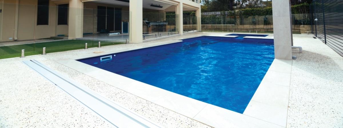 Exposed concrete surrounding a pool