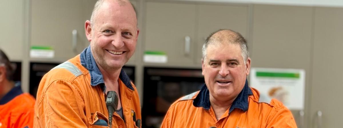 Geoff Smith and Darren Tickner cutting cakes at Berrima