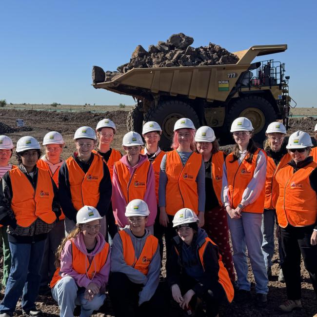 Students with haul truck at Deer Park quarry