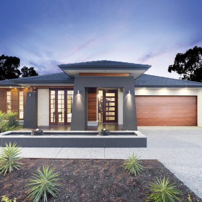 House with exposed concrete driveway