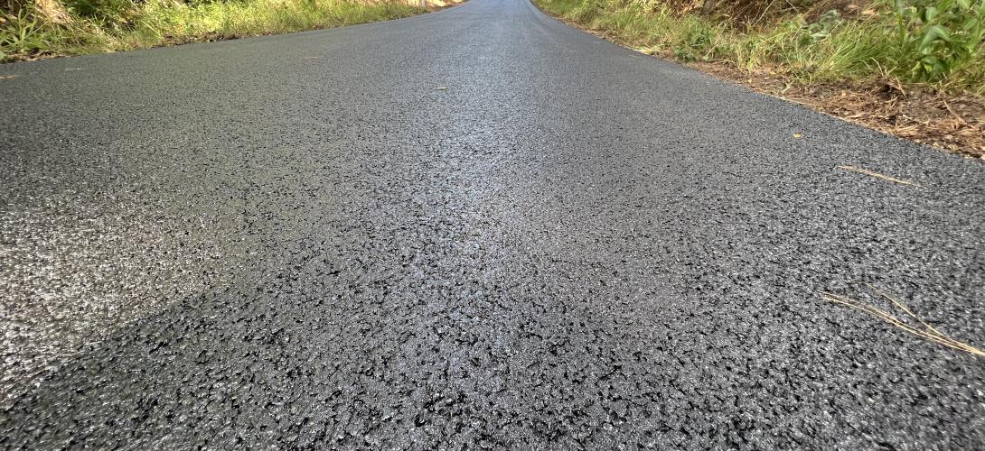 Road paved with asphalt mixed with crumbed rubber