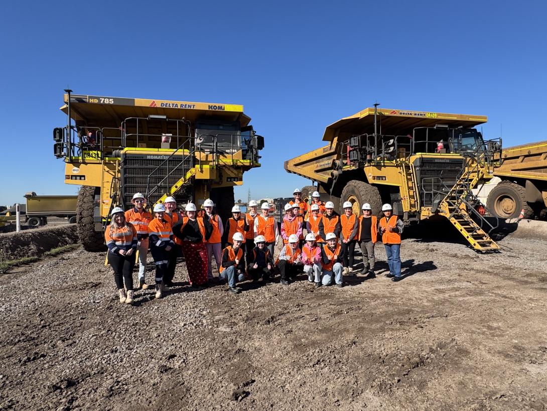 Students with haul trucks at Deer Park quarry
